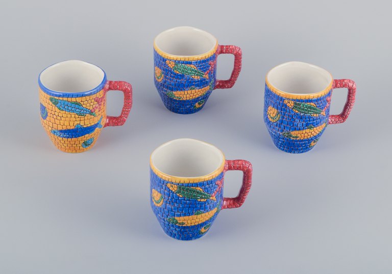 Vietri, Italy. Set of four large ceramic mugs. Decorated with fish and sea motifs in a mosaic-like pattern.