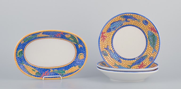 Vietri, Italy. Set of three large deep plates and a rectangular dish in ceramic. Decorated with fish and sea motifs in a mosaic-like pattern.