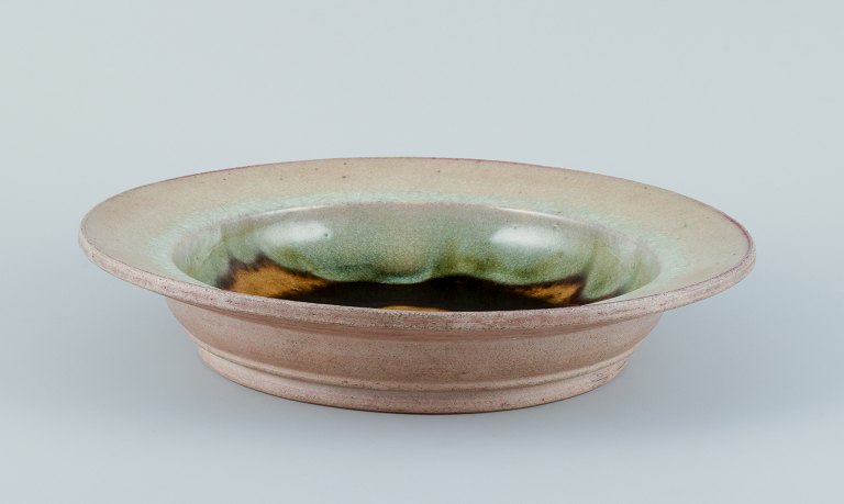 Nils Kähler for Kähler. Large ceramic bowl in modernist design.Uranium glaze with blue and green hues.