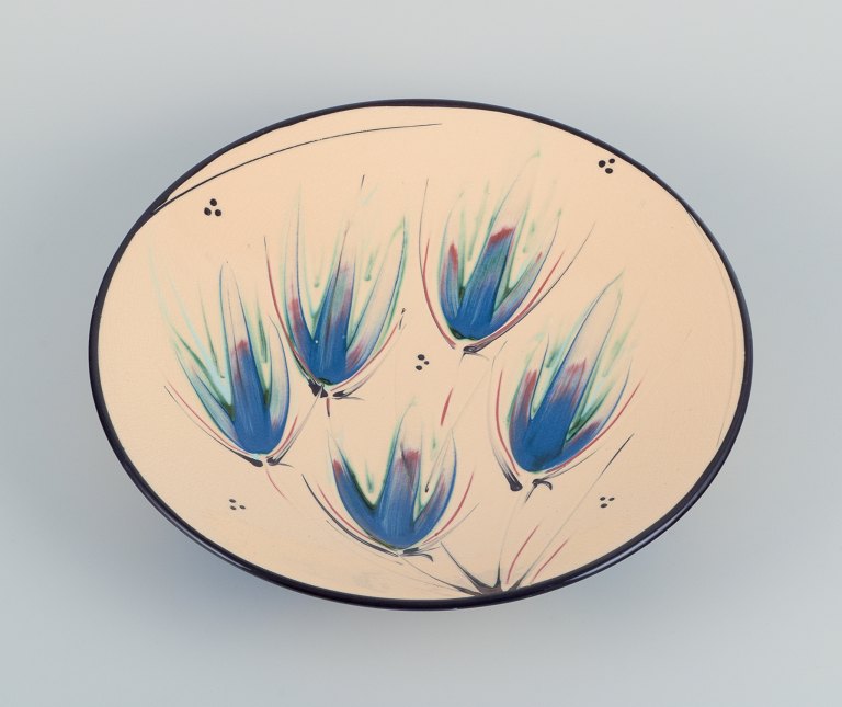 Heidi Fournier for Kähler, Denmark. Large ceramic bowl. Floral motifs on a cream-colored base.