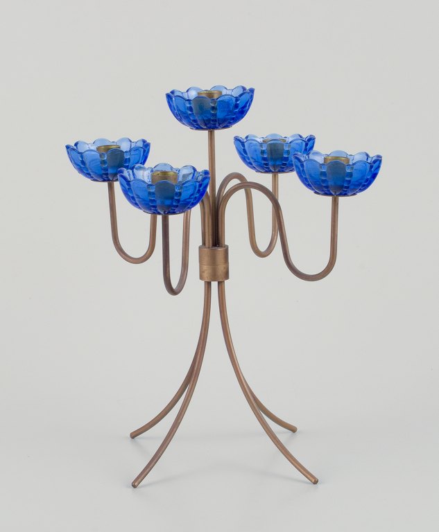Gunnar Ander for Ystad Metall, Sweden. Tall candlestick holder in brass and blue art glass shaped like flowers. For five candles.