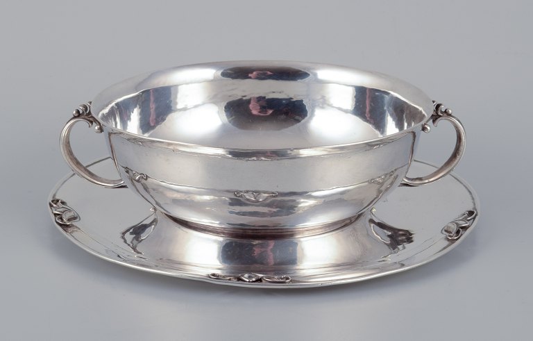 Harald Nielsen for Georg Jensen. Bowl with handles on matching sterling silver saucer.