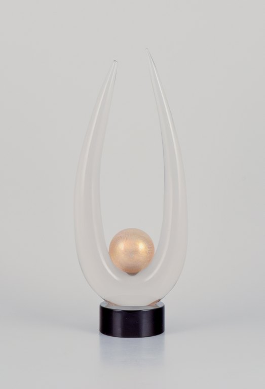 Archimede Seguso for Murano, Italy. Large art glass sculpture.Clear glass on a black base with a gold-colored sphere. Mouth-blown.