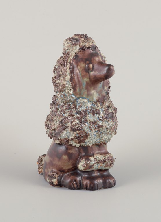 EGO Lidköping, Stoneware, Sweden. Ceramic figure of a standard poodle. Glazed in brownish-green hues.
