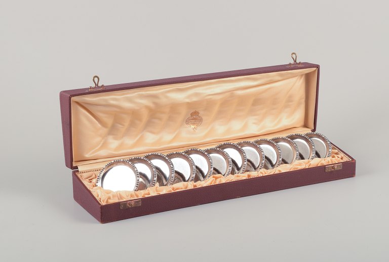 Hallberg, Stockholm, Royal Swedish Court Supplier. A set of twelve coasters in 830 silver. Art Deco.