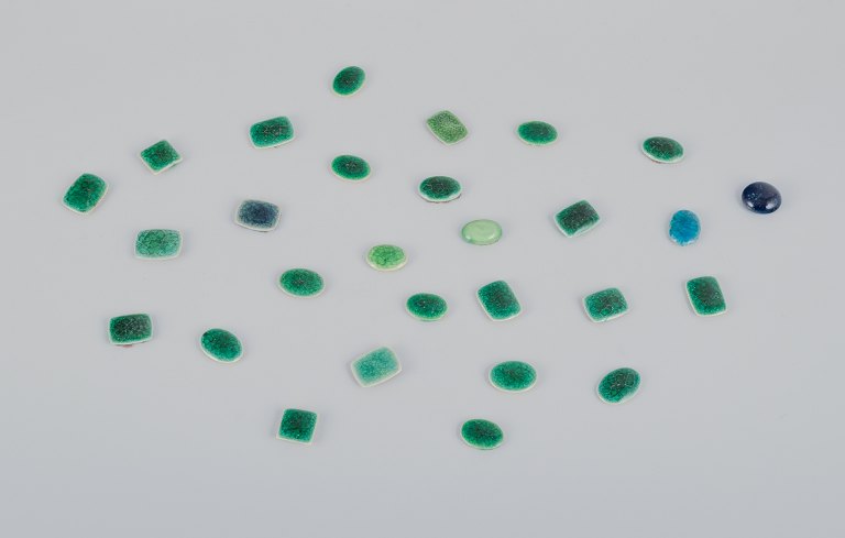Ole Bjørn Krüger (1922-2007), Danish sculptor and ceramicist.28 unique brooches in glazed stoneware in green shades.