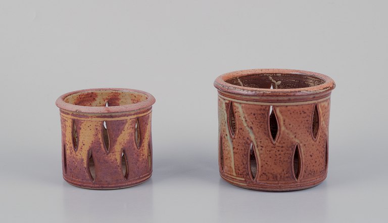 Elly Kuch (1929-2008) and Wilhelm Kuch (1925-2022).Two unique ceramic plant pot covers.