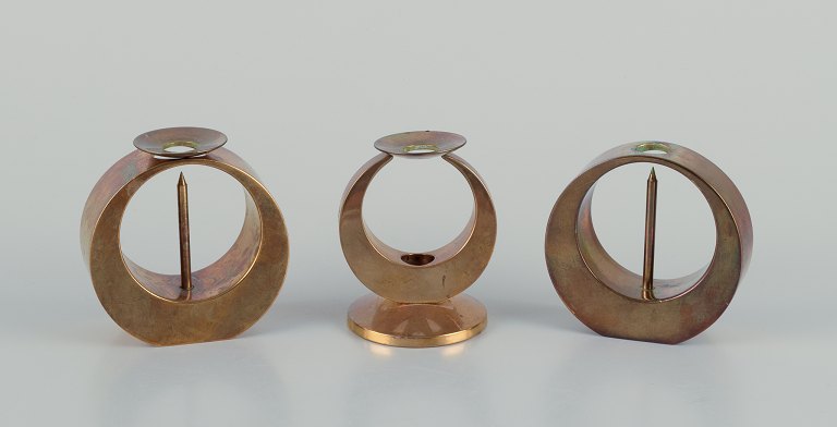 Arthur Pe for Kolbäck, Sweden.Three brass candlesticks.