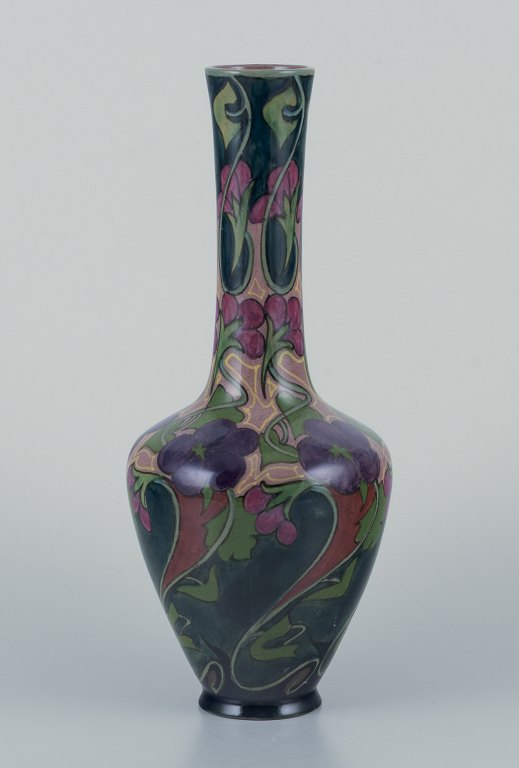 Zuid-Holland, Gouda. Unique Art Nouveau vase in glazed ceramic with hand-painted floral motifs.
