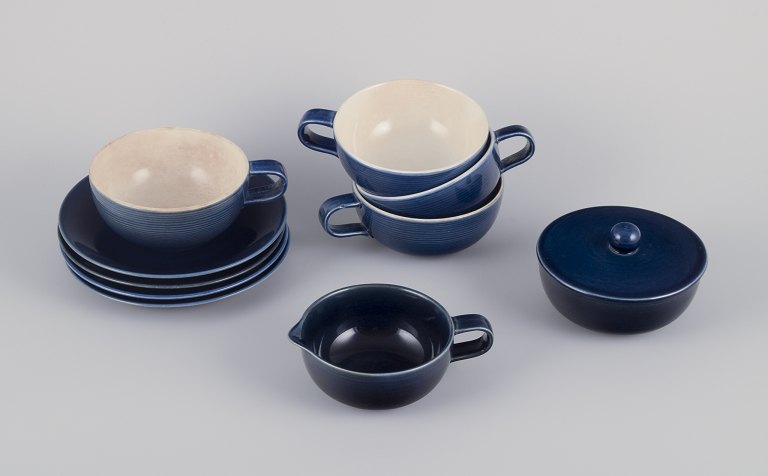Gertrud Lönegren for Rörstrand, Sweden.Set of four "Blå Blanche" teacups with saucers, a sugar bowl, and creamer.