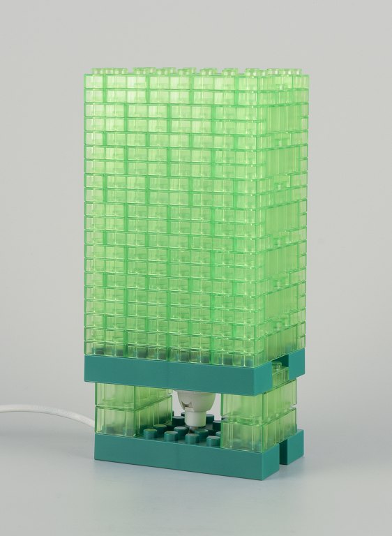 Scandinavian design. Table lamp in green plastic.