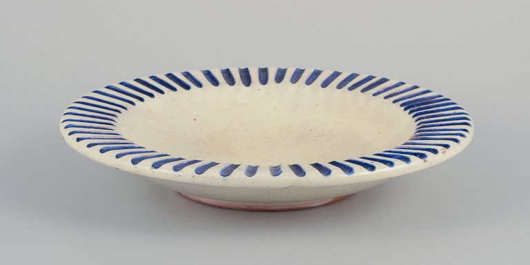 Danish studio ceramicist.Ceramic bowl with fluted design.