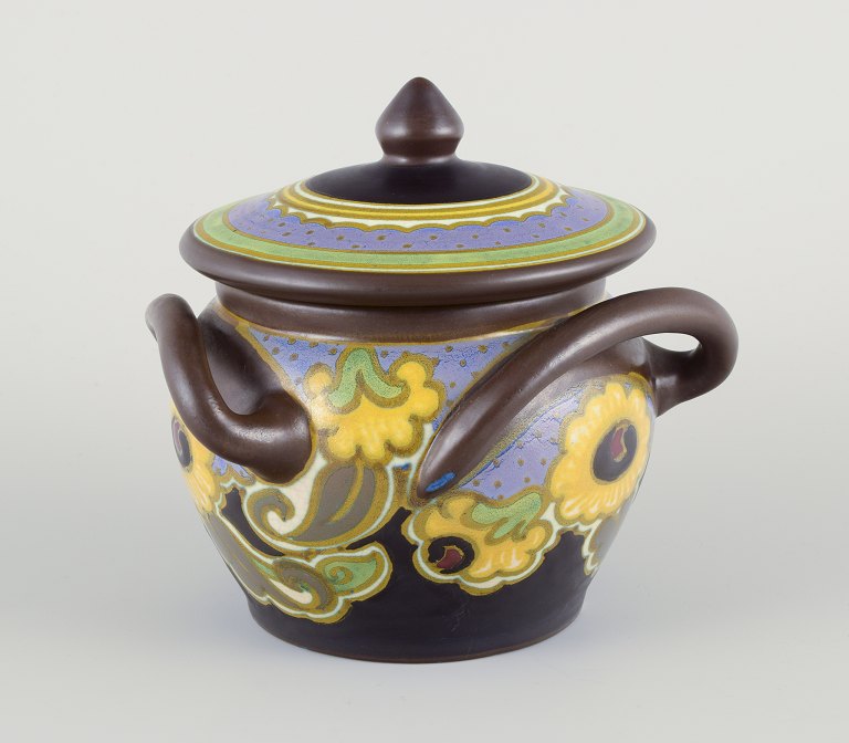 Gouda, Netherlands.Beautifully crafted lidded jar with three handles.
