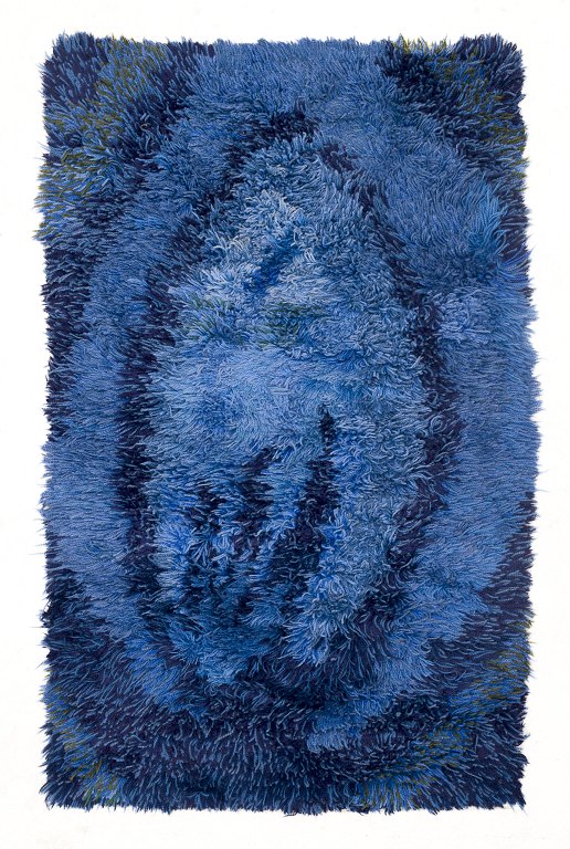 Skandinavisk tekstildesigner.
Ryatæppe af bomuld.