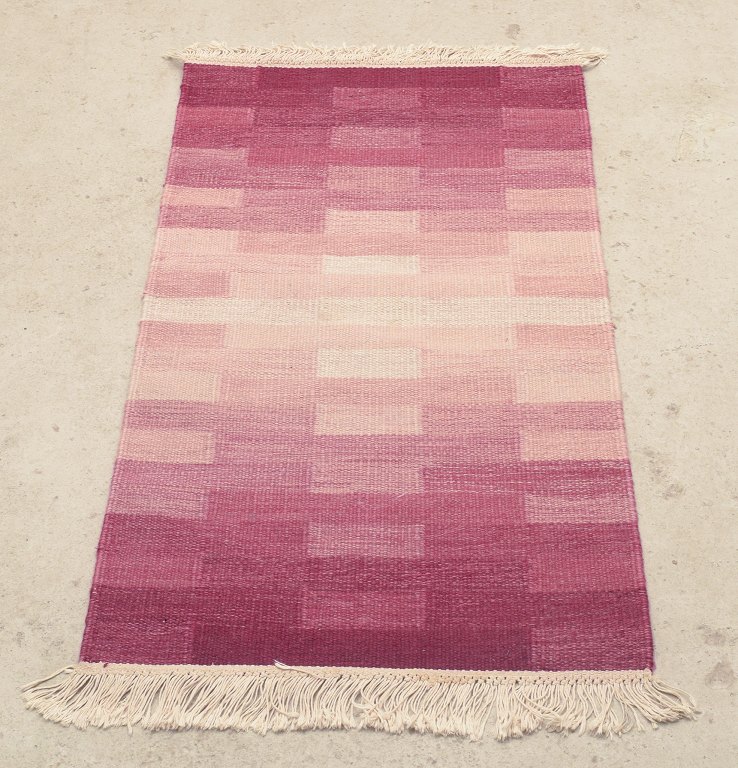 Swedish textile designer.Handwoven “Terass” rug in wool. Rölakan technique.