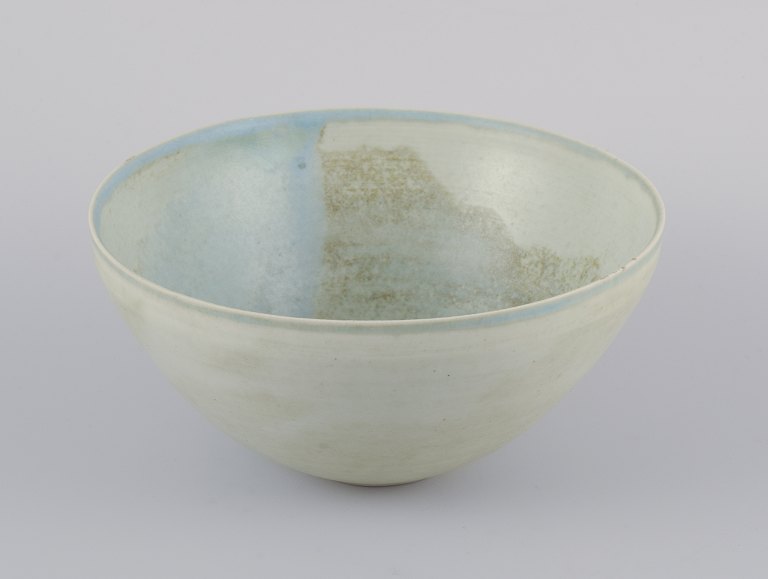 European studio ceramicist.Unique stoneware bowl. Hand-glazed in light tones.