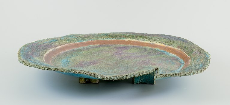 Édouard Massier (1856–1920), French ceramicist.Colossal unique dish of glazed ceramic, on three feet.