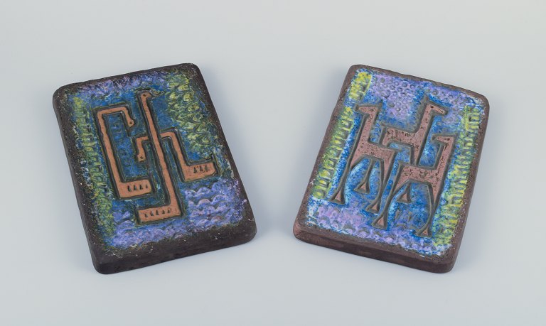 Berth Ferdinand Norrman, Motala, Sweden.A pair of wall reliefs of glazed stoneware.