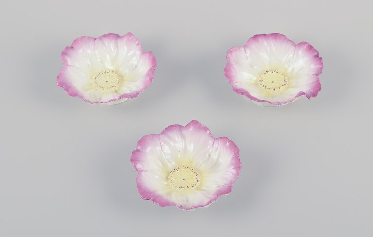 Three small French Art Nouveau bowls in faience.Floral motif. Hand-painted in yellow and pink.