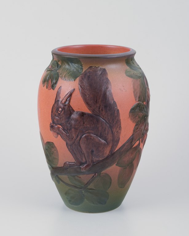 Ipsens, Denmark, ceramic vase with squirrel, glaze in orange and green tones.