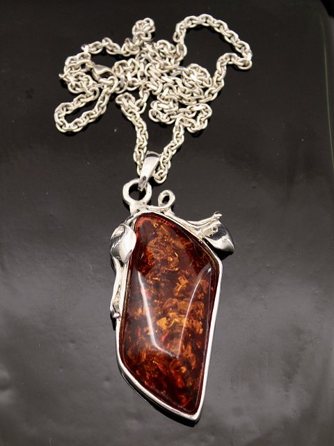 Sterling silver pendant with amber
