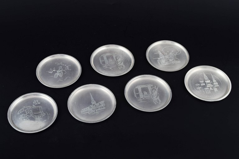 Just Andersen, Denmark.Set of seven pewter bottle coasters.