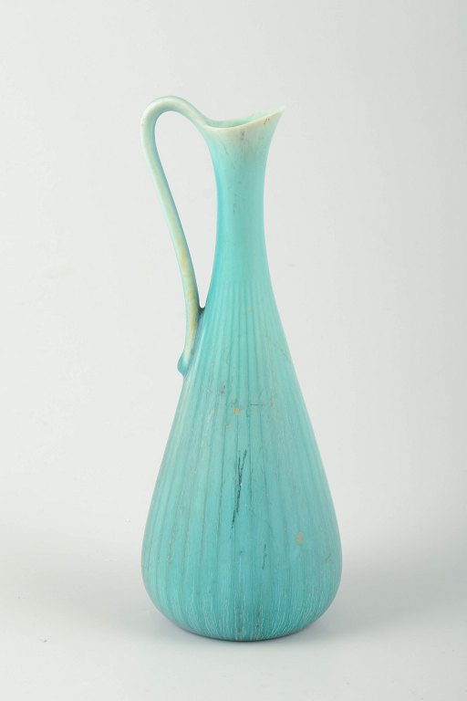 Rörstrand, SwedenPitcher in turquoise glaze with ribbed body and elegantly curved handle.
