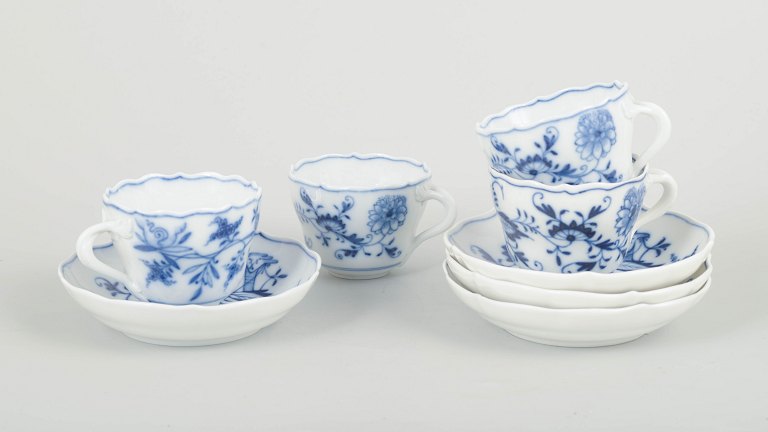 Meissen – “Blue Onion”Set of four demitasse cups with saucers, late 19th century.