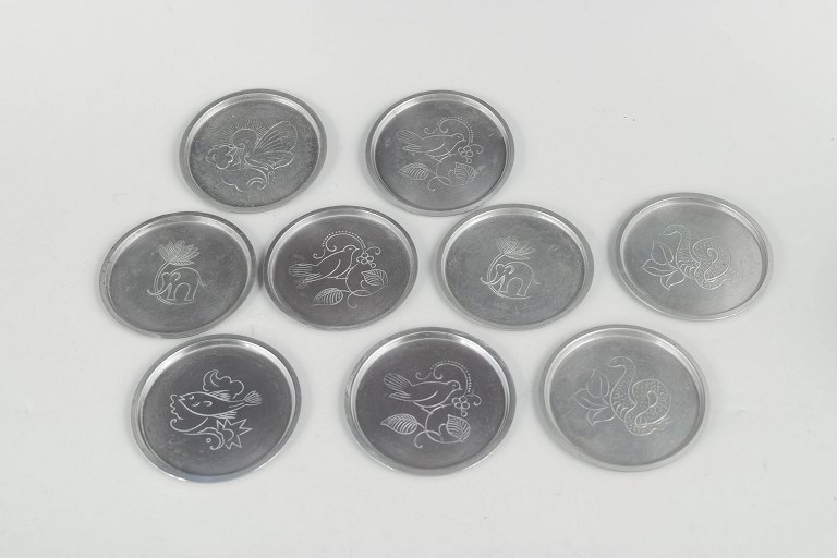 Just Andersen, set of nine pewter coasters.